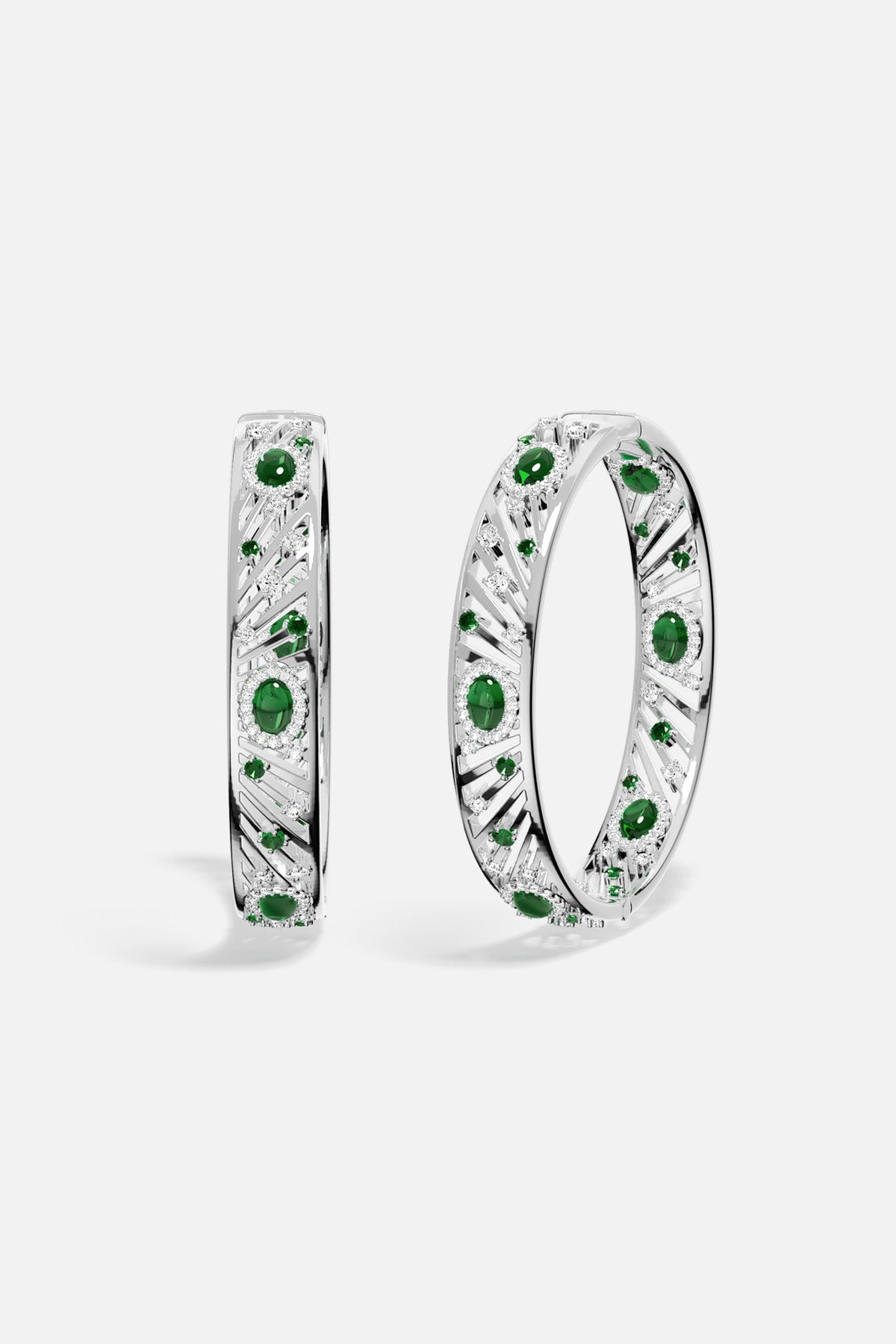 APM Bangles in rhodium finish with emerald green stones, radiant elegance with a modern edge.