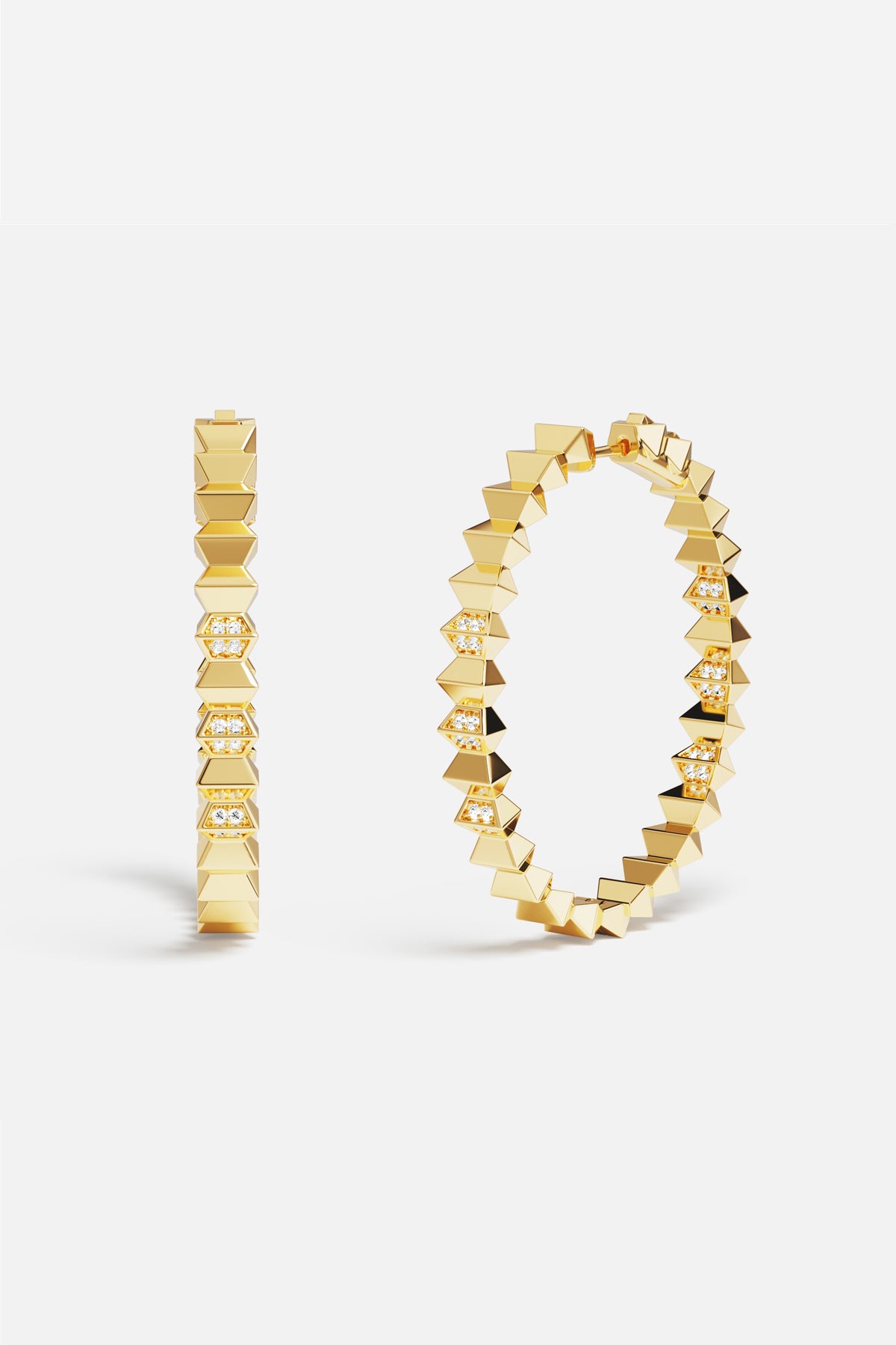 APM Hoop Earrings in gold color, bold edges meeting quiet sparkle.