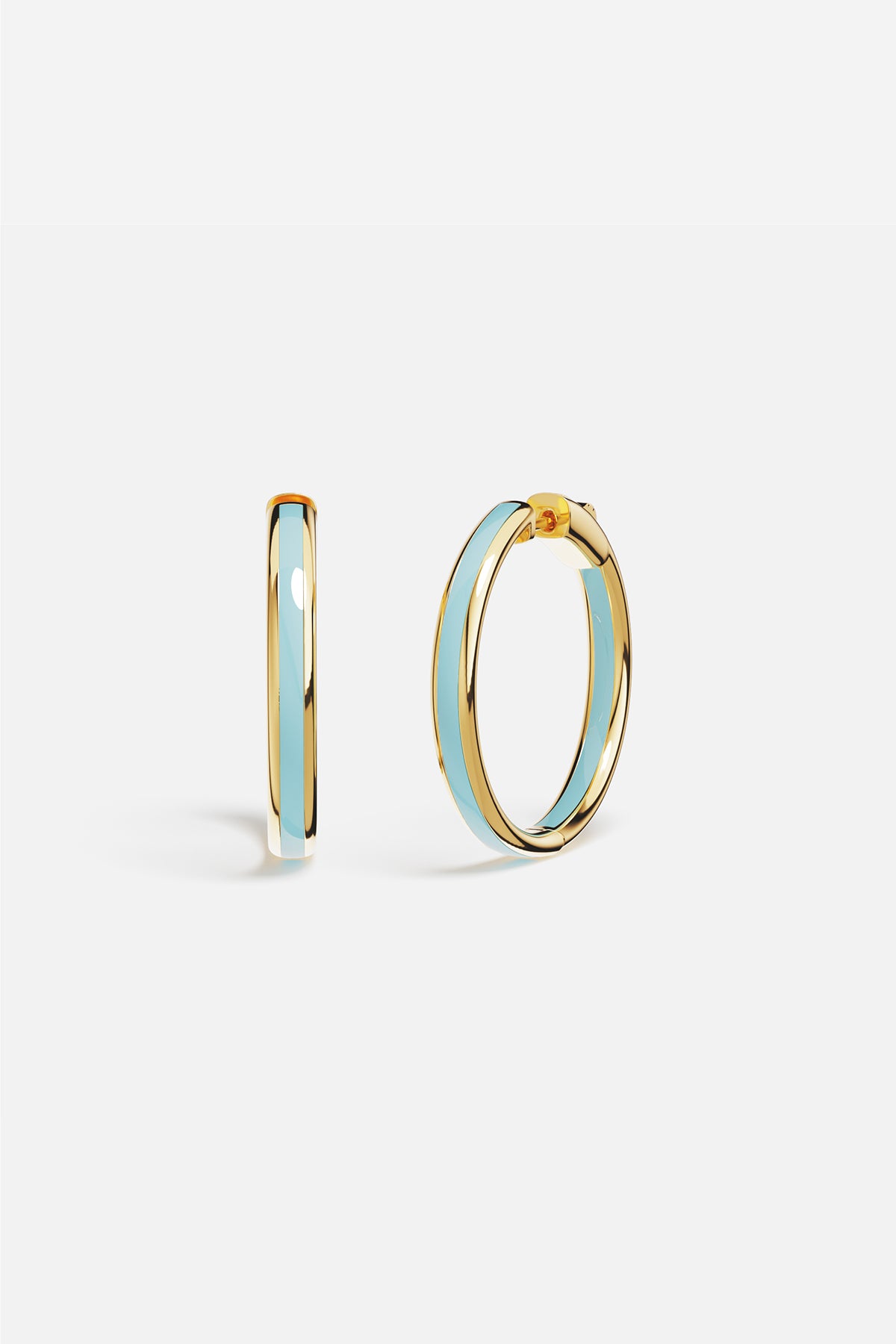 APM Hoop Earrings in golden hue with soft blue enamel, effortlessly radiant.