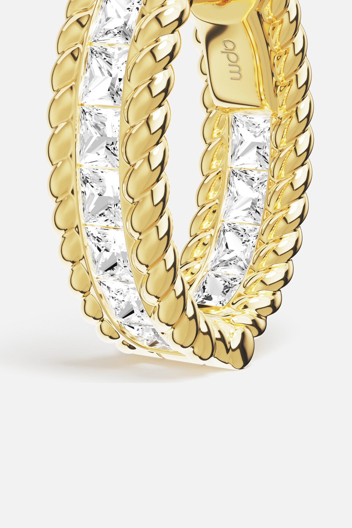 APM Hoop Earrings in golden color, twisted rope elegance meets radiant sparkle.