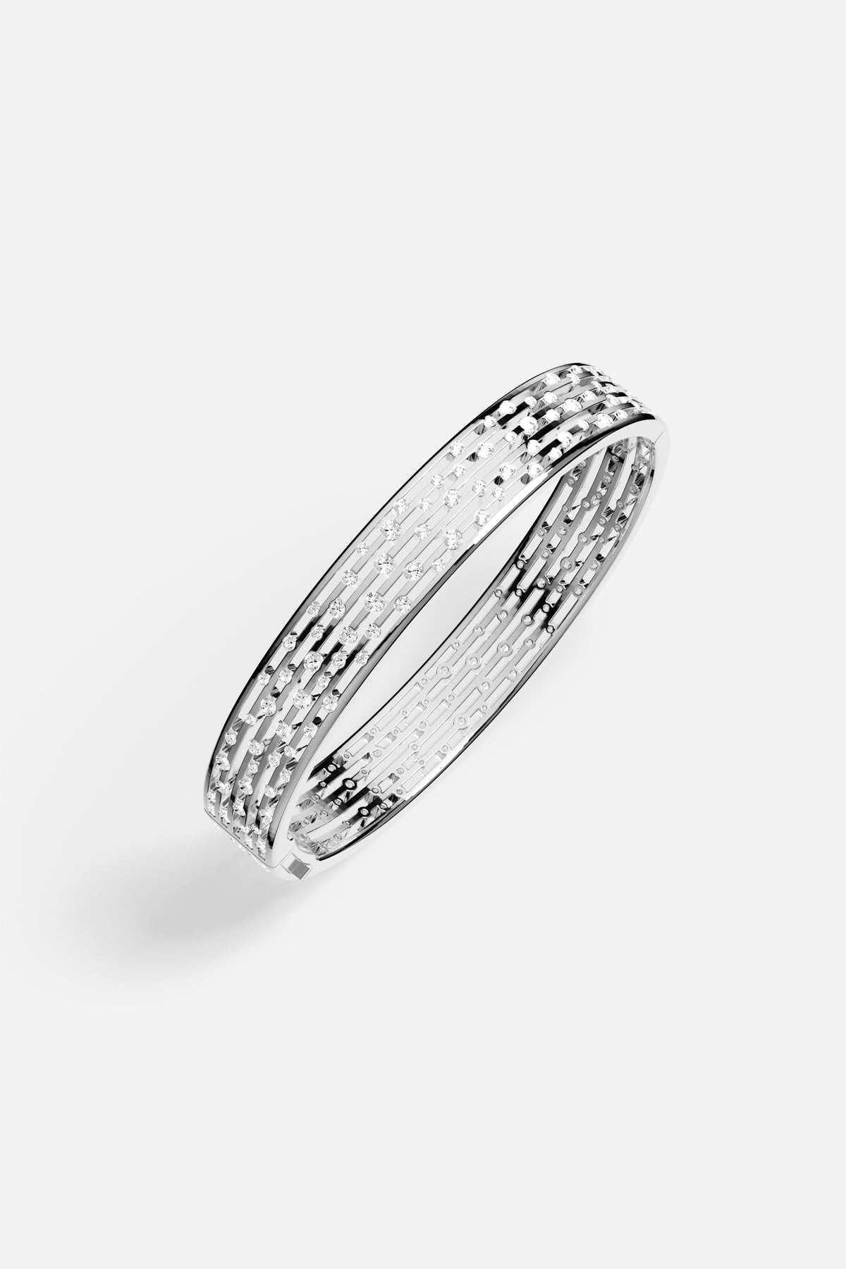 APM Monaco bangle in rhodium finish, luminous architectural lines with a modern sparkle.