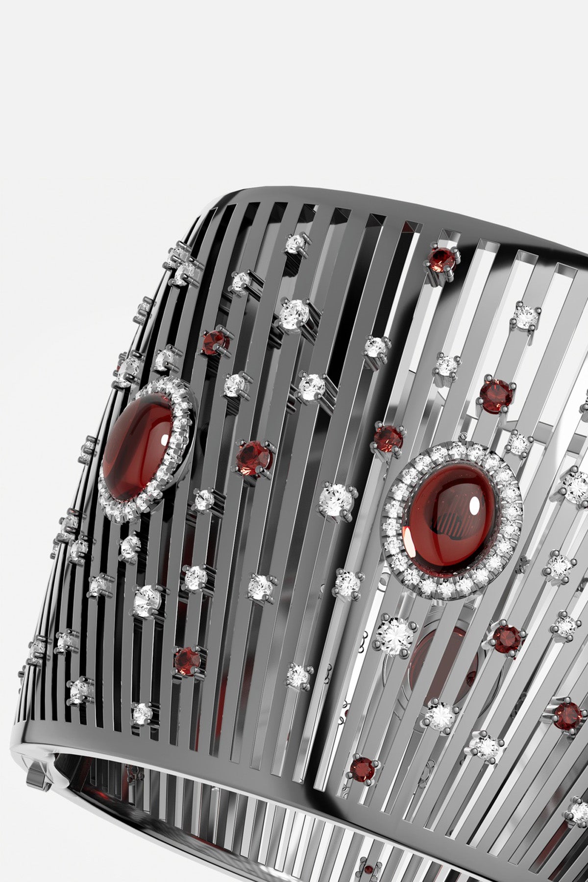 APM Monaco cuff bracelet in rhodium finish, scattered with crimson stones for bold allure.