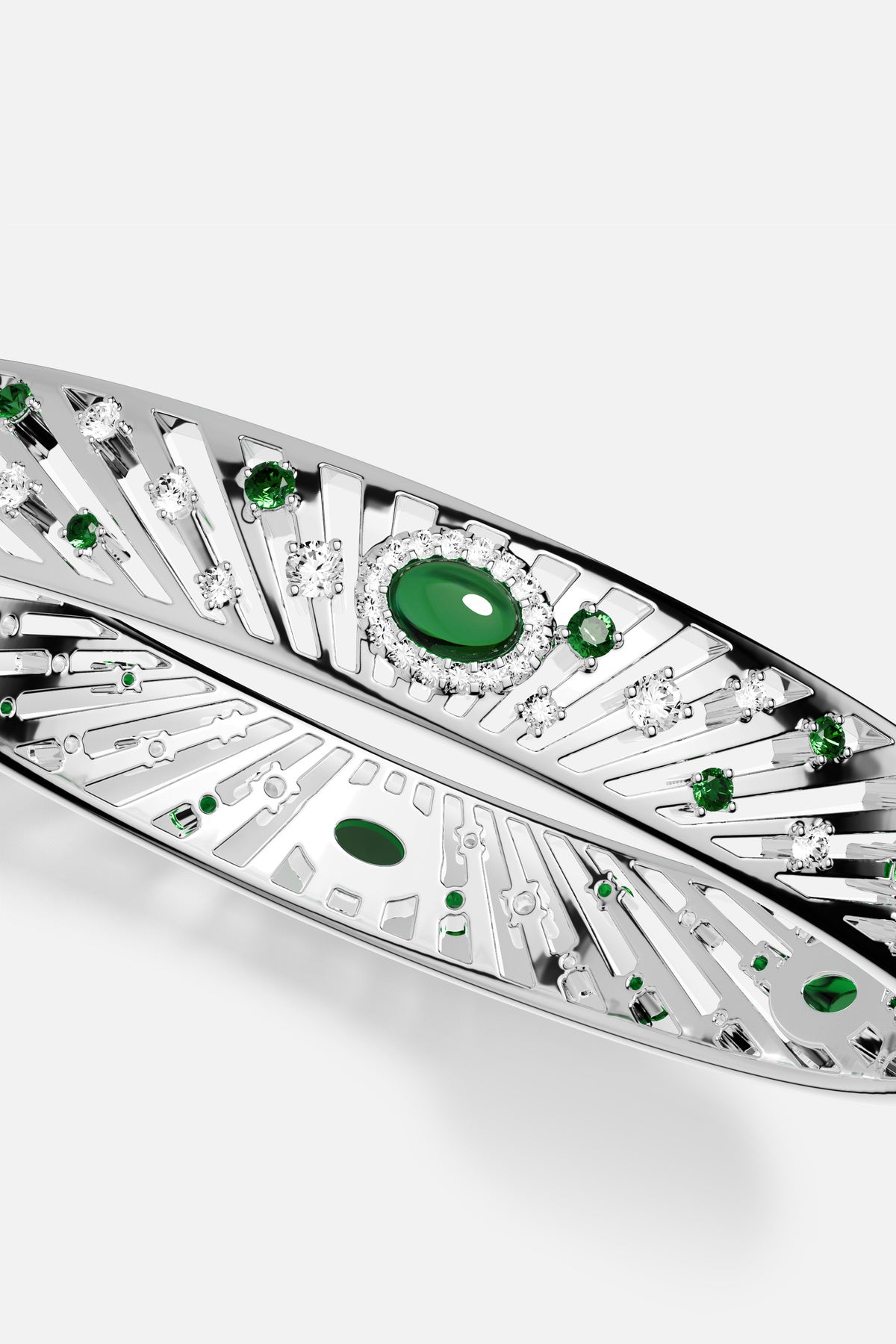 APM Monaco bangle in rhodium finish, radiant with green and clear stones.