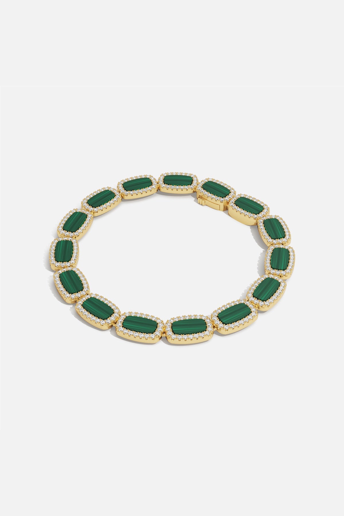 APM Monaco bracelet in gold color with green stones, radiating quiet elegance.