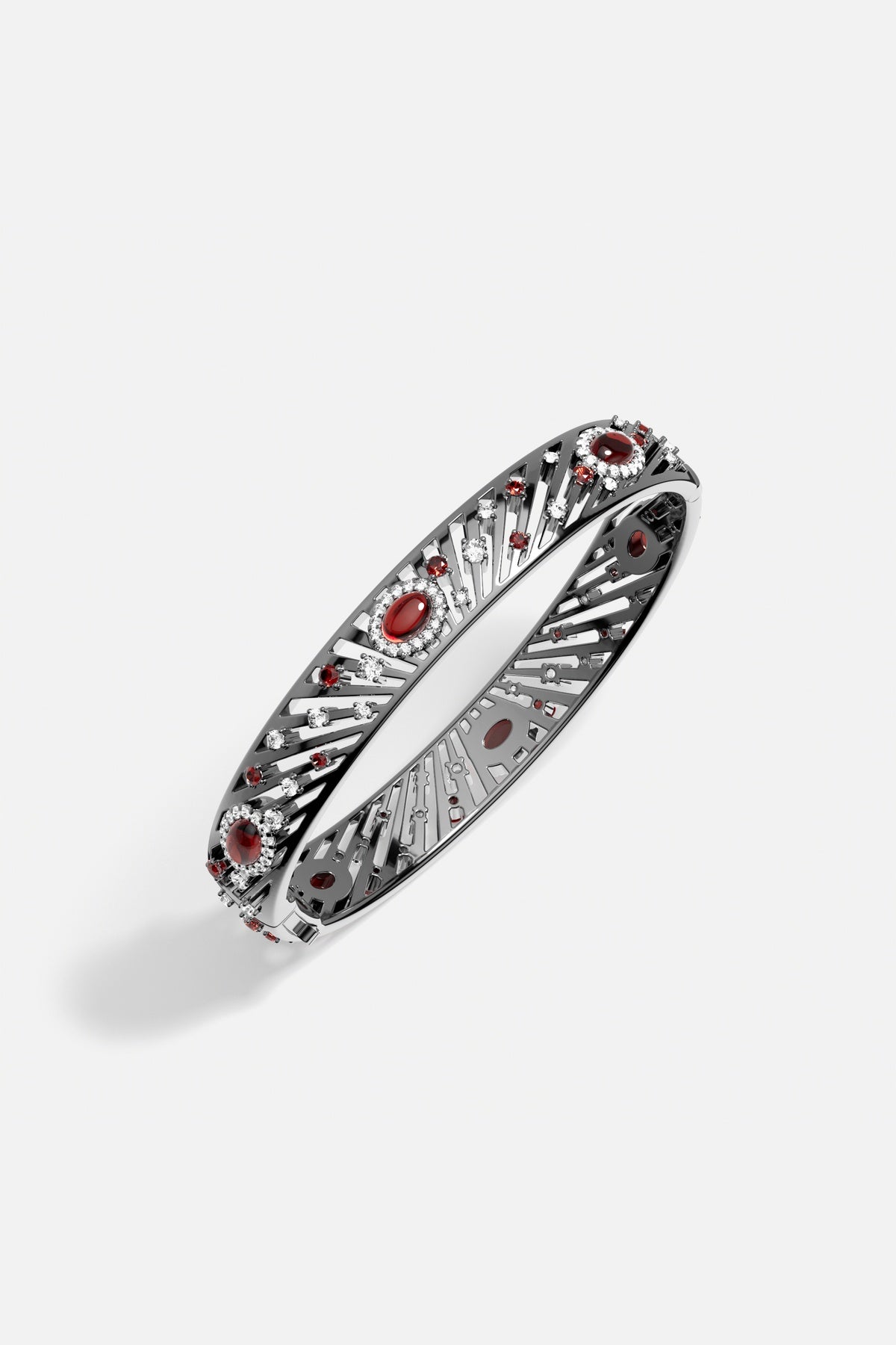 APM Bangle in rhodium finish, radiant with crimson glow and quiet celestial charm.