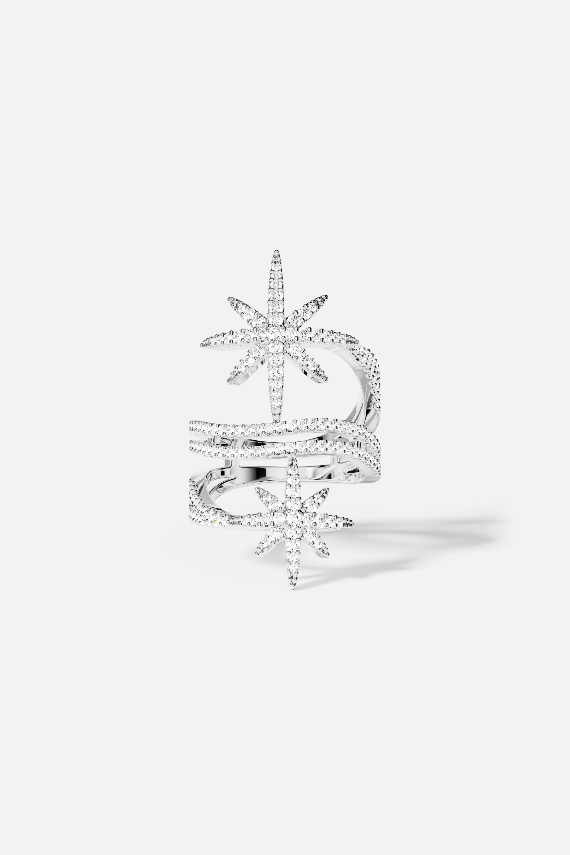 Rings APM Monaco. White metal ring with two star-shaped accents on the band, forming a double-star design.