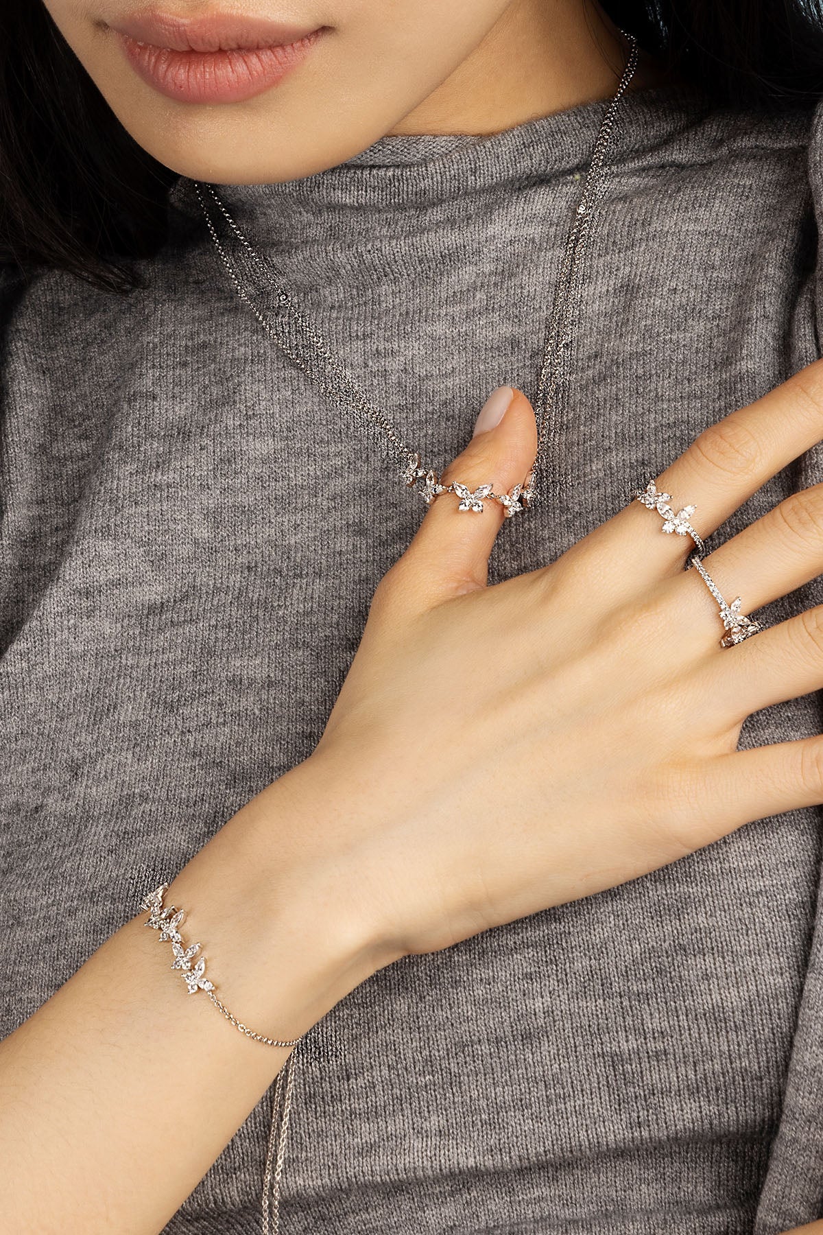 Rings APM Monaco: silver-tone butterfly ring with pavé stones.