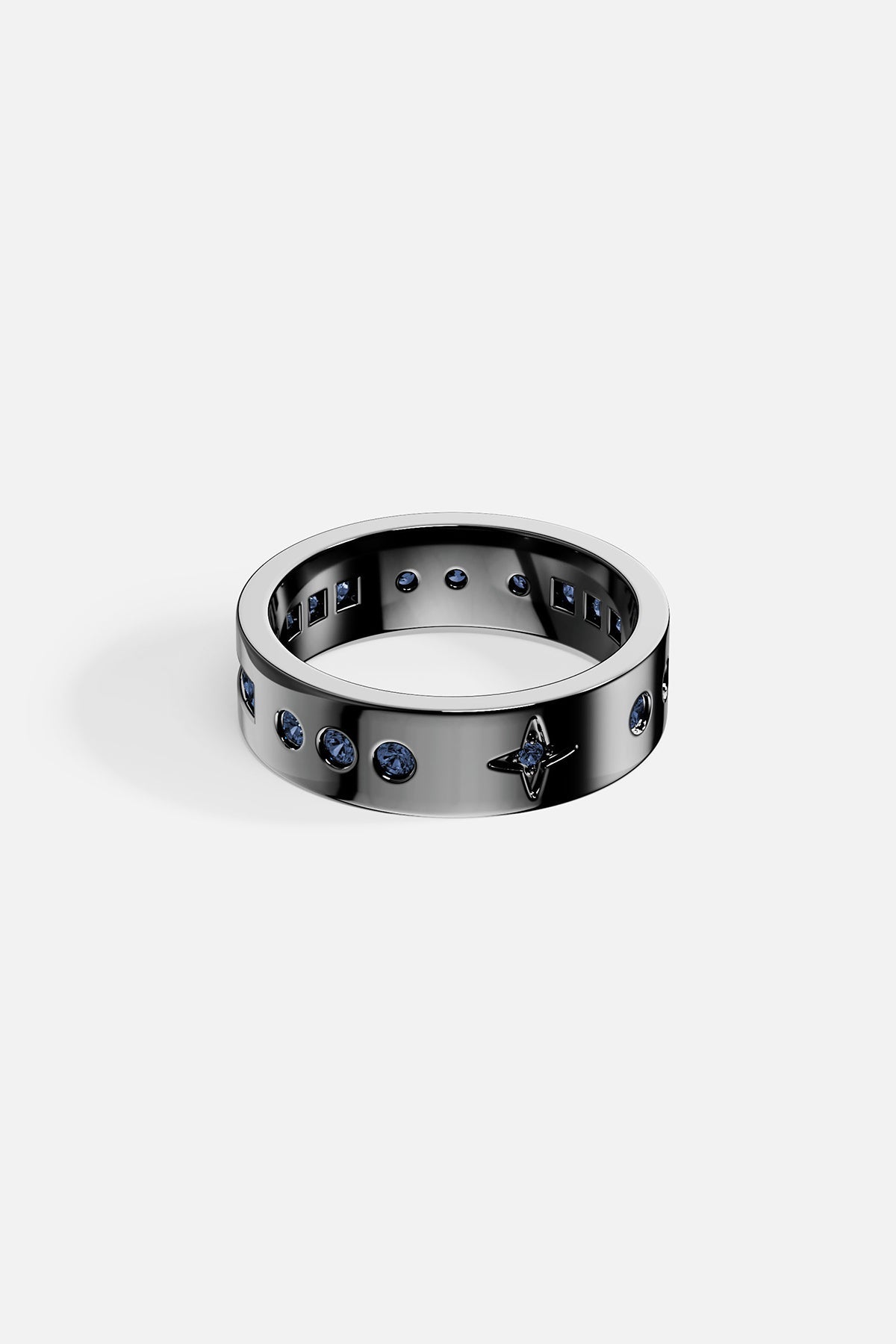 Rings APM Monaco. Silver ring with a row of blue gemstones on the top and 'SMILE' engraved inside.