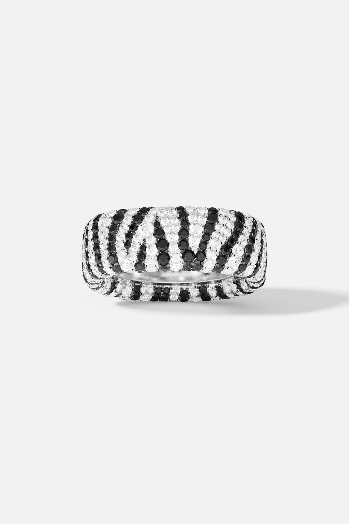 Rings APM Monaco with a chunky zebra-pattern band in black and white, featuring pavé crystals covering the surface.