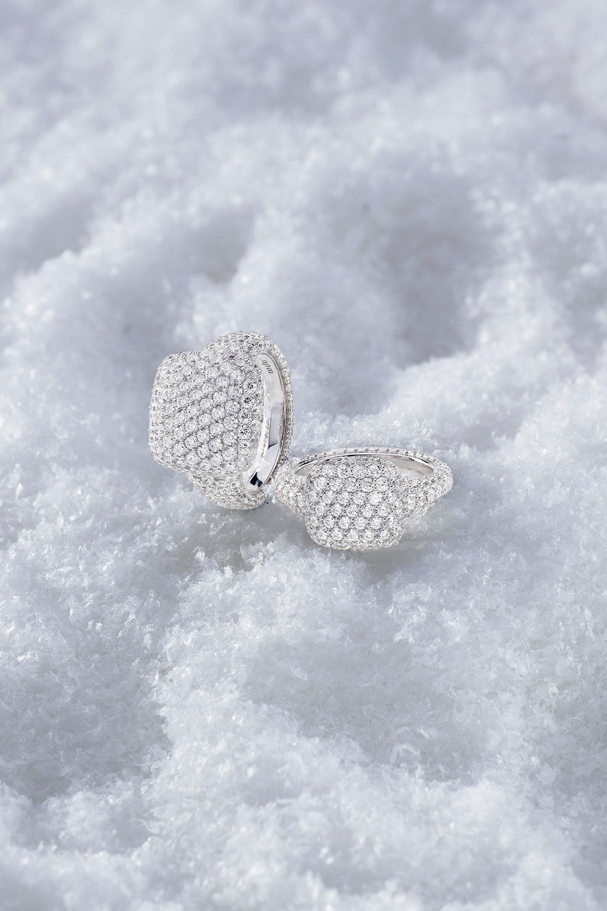 APM MONACO pave ring in silver on textured snow surface