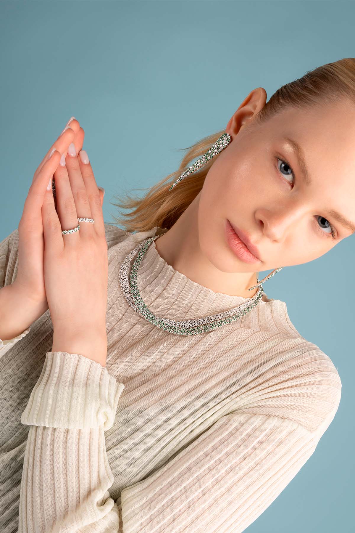 Ring — APM Monaco; pastel-green drop ring with a silver band and a teardrop-shaped stone.