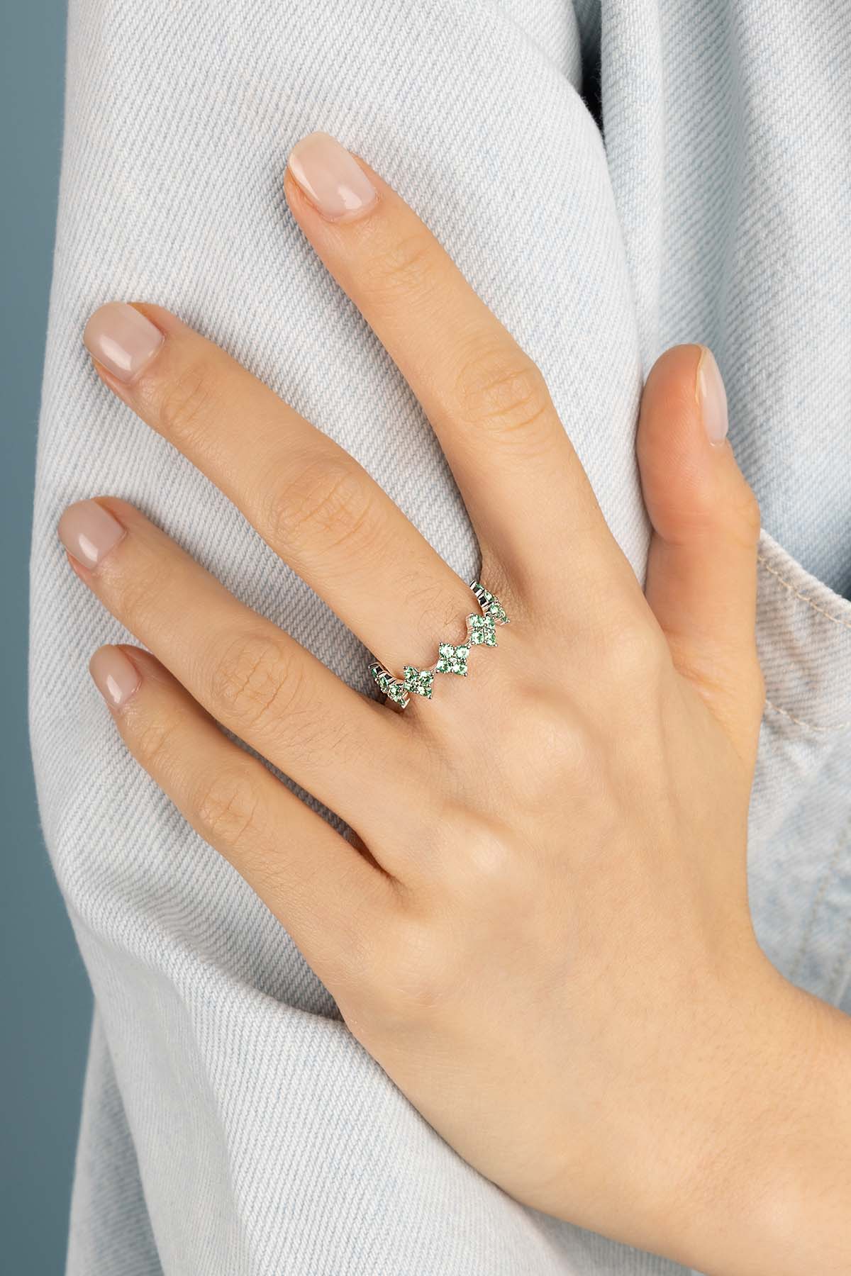 Rings APM Monaco, pastel-green spark ring featuring pavé green stones arranged in a flower motif.