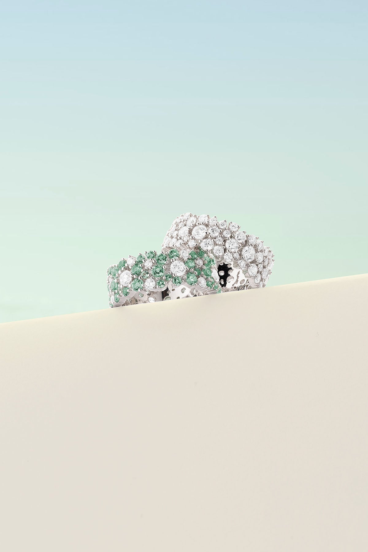 Rings APM Monaco two decorative rings, pastel-green drop ring and white-stone pavé ring.
