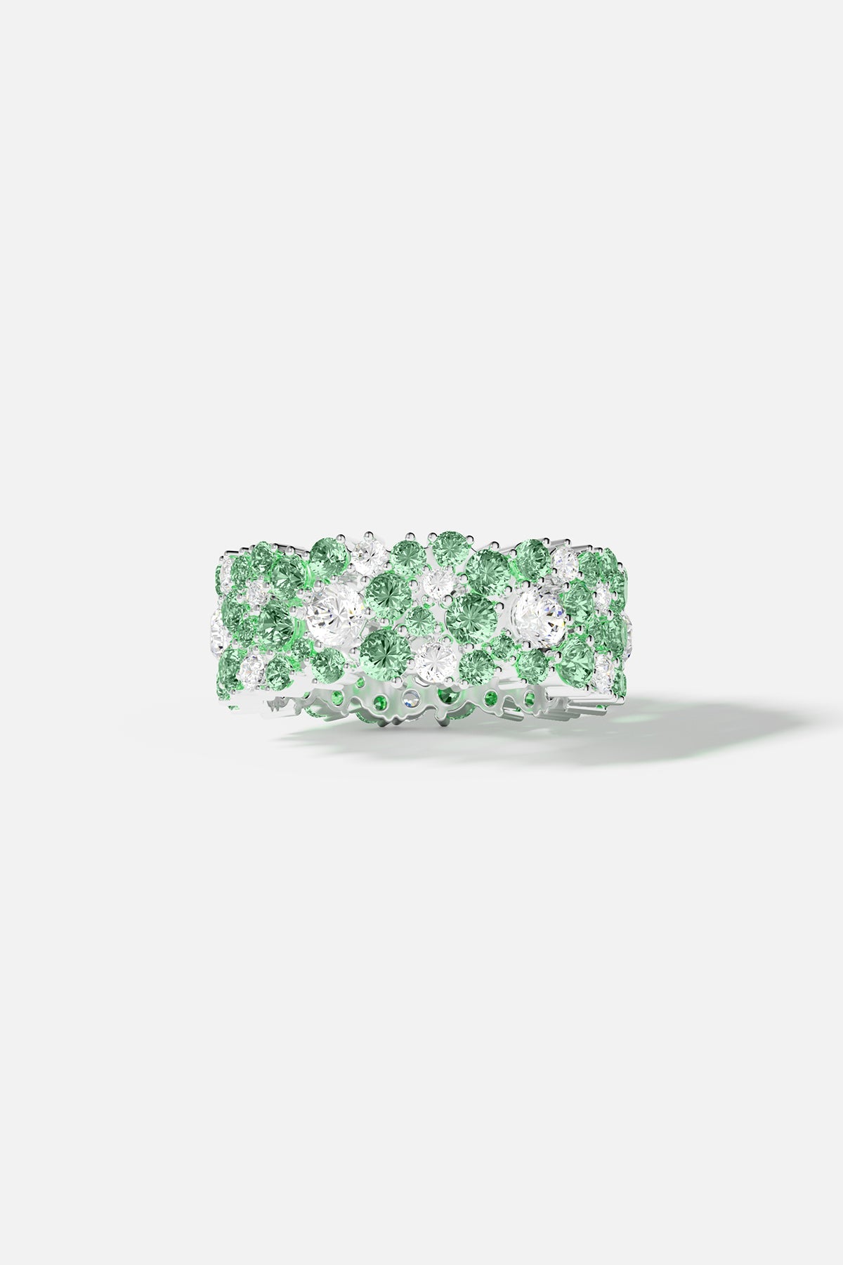 Ring APM Monaco, pastel-green drop ring with a silver-tone band encrusted with green and white stones.