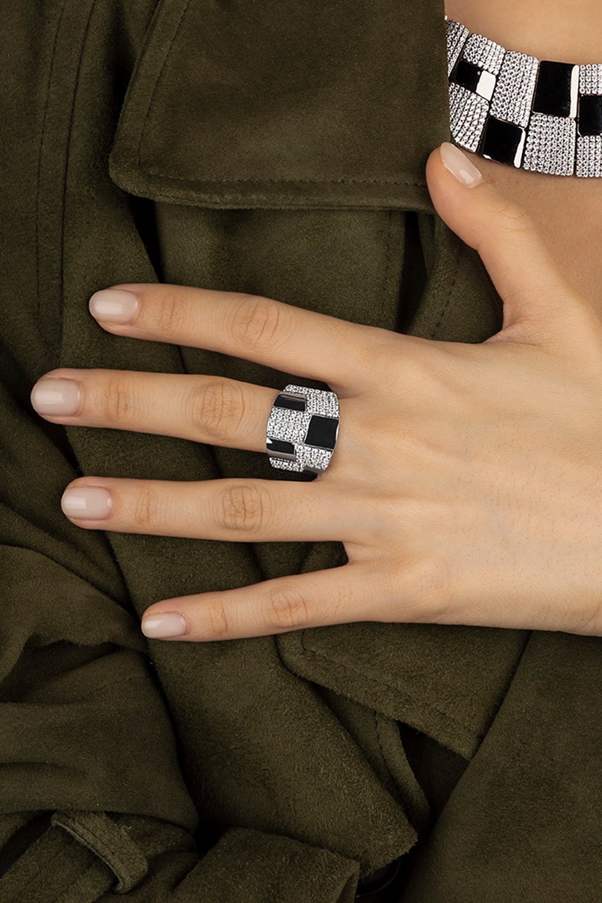 Hand wearing a APM Monaco Statement Pavé Ring in dark grey