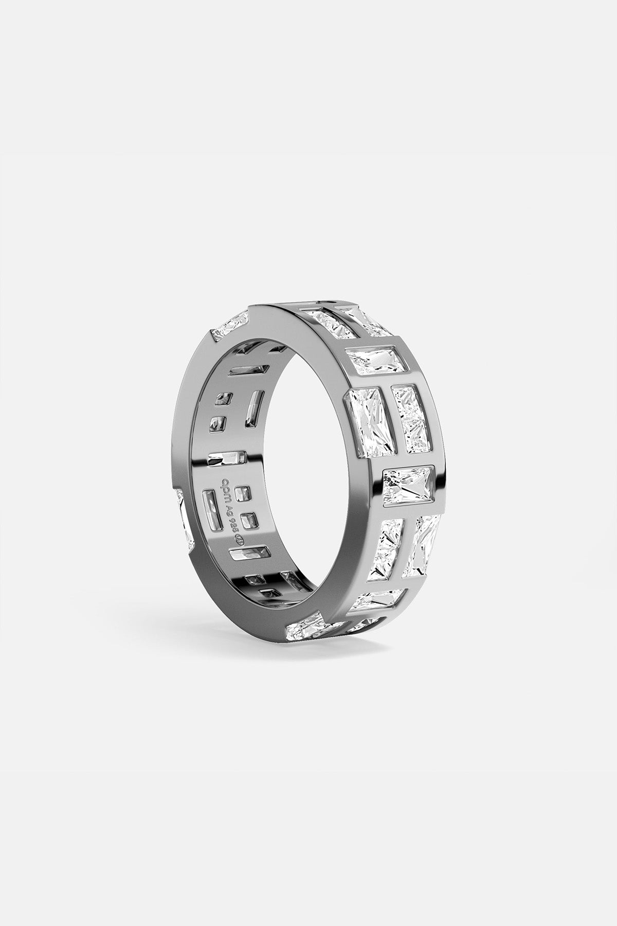APM MONACO labyrinth ring in silver with embedded white stones on a white background