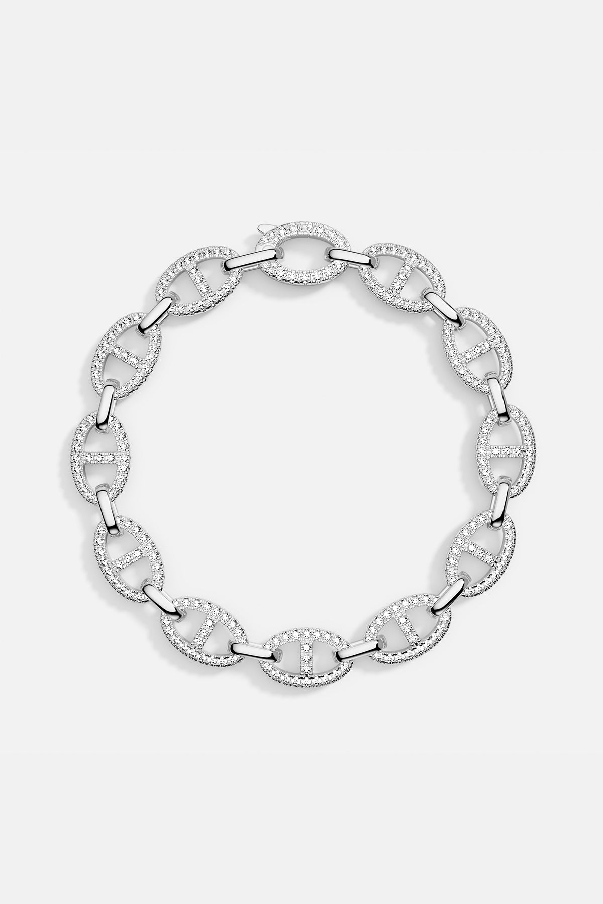 A sterling silver chain bracelet paved with white cubic zirconia, displayed in a circular arrangement to highlight the link design.