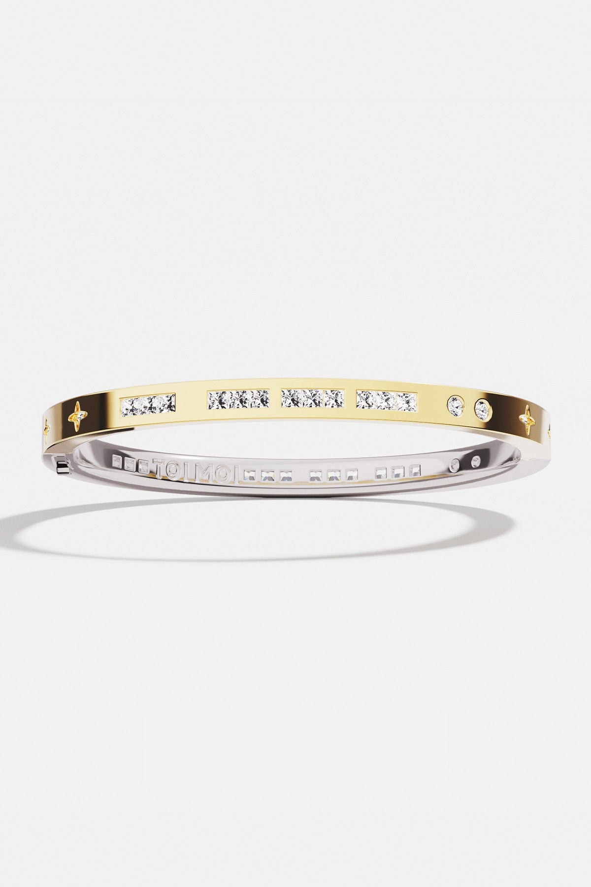 Bracelets APM Monaco two-tone morse-code bangle with crystals and star accents.