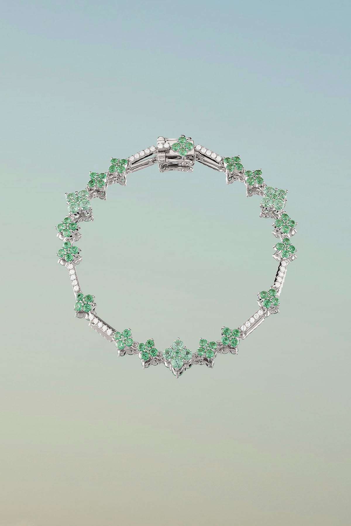 Bracelets APM Monaco, white gold bracelet with pastel green stones and pave sparkle.