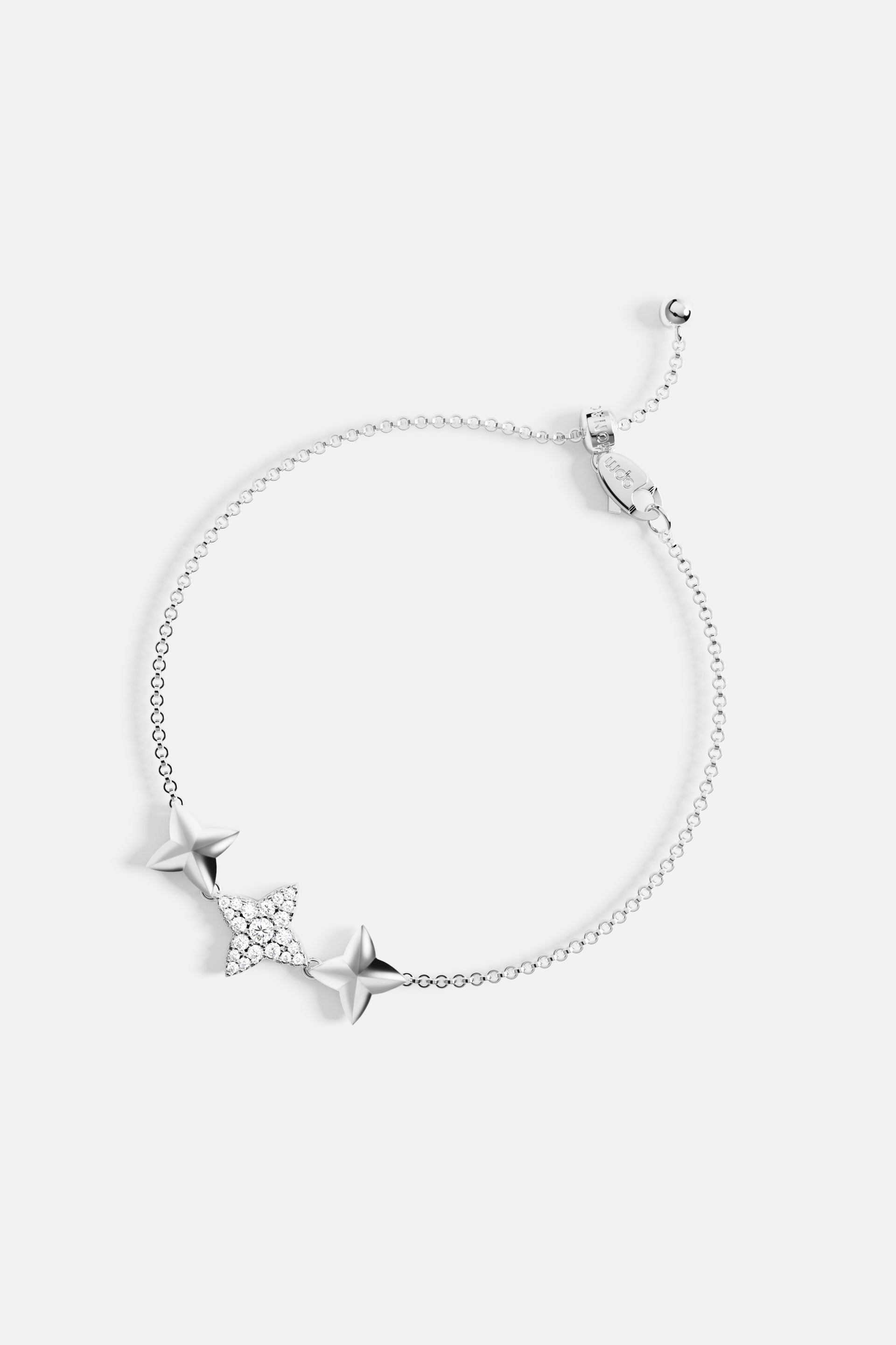 Bracelets APM Monaco. Silver-tone adjustable bracelet featuring three star charms; the center star is encrusted with crystals, with the outer stars plain silver for a subtle, sparkly look.