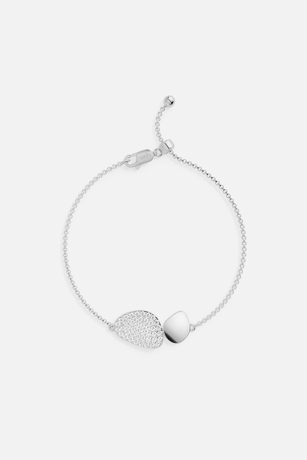 Bracelets APM Monaco Galet adjustable bracelet, white/silver tone, pavé crystal accents on an asymmetrical charm.