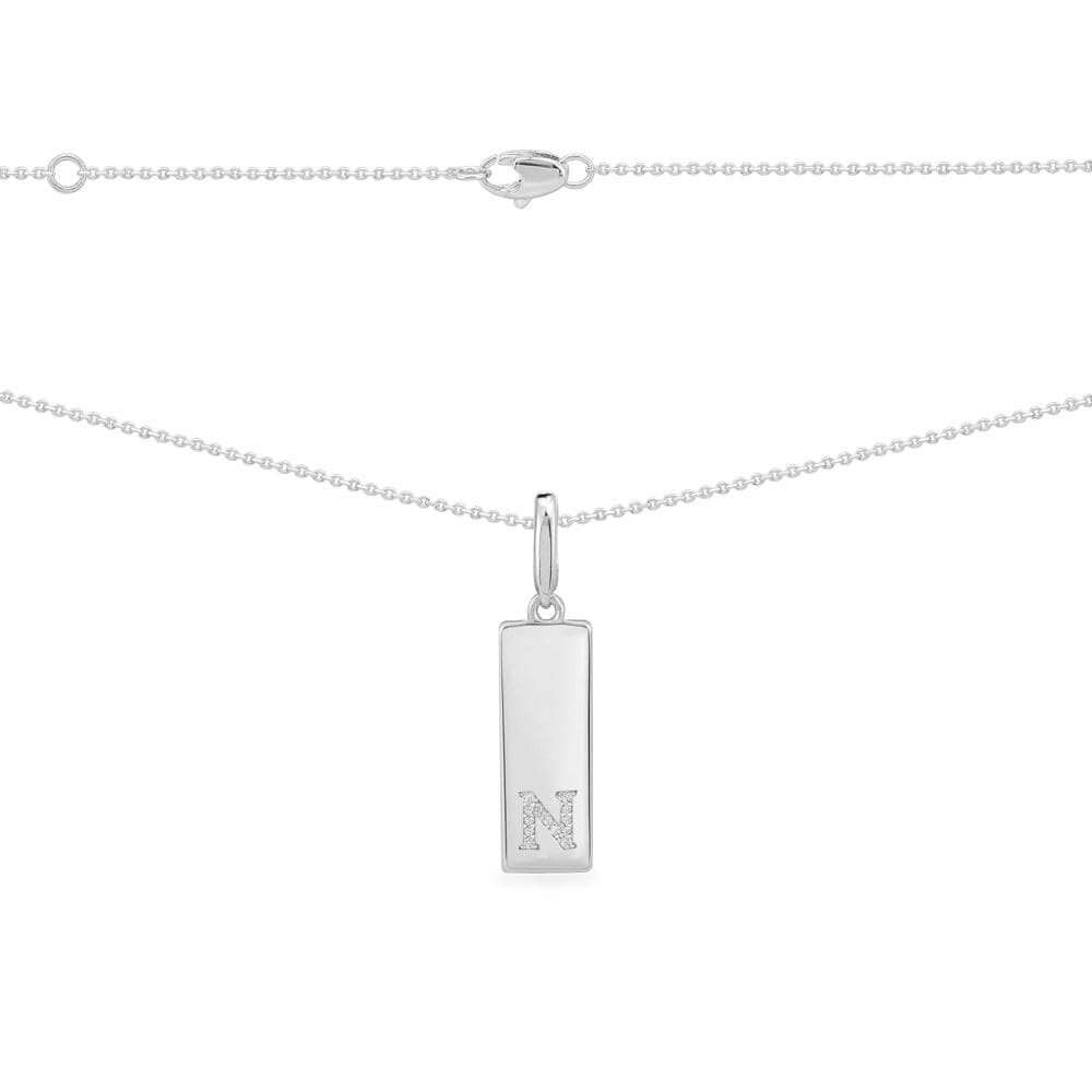 Necklaces APM Monaco. Silver chain necklace with a tag pendant featuring a capital N set with small pavé diamonds.