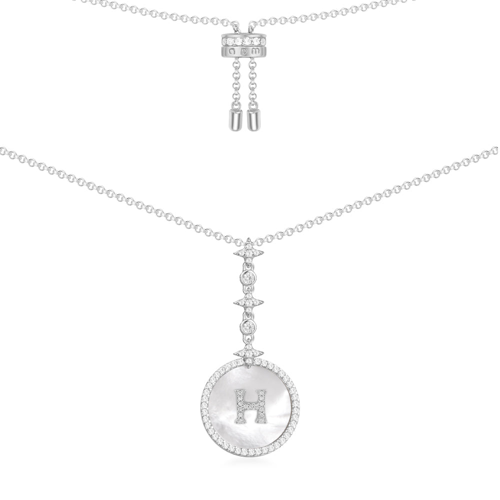 Necklaces APM Monaco: silver chain with a circular pendant featuring an H initial charm.