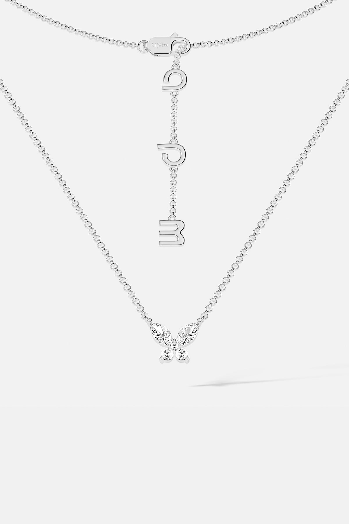 Necklaces APM Monaco. White gold butterfly necklace with white cubic zirconia on a silver chain; butterfly pendant and APM clasp.