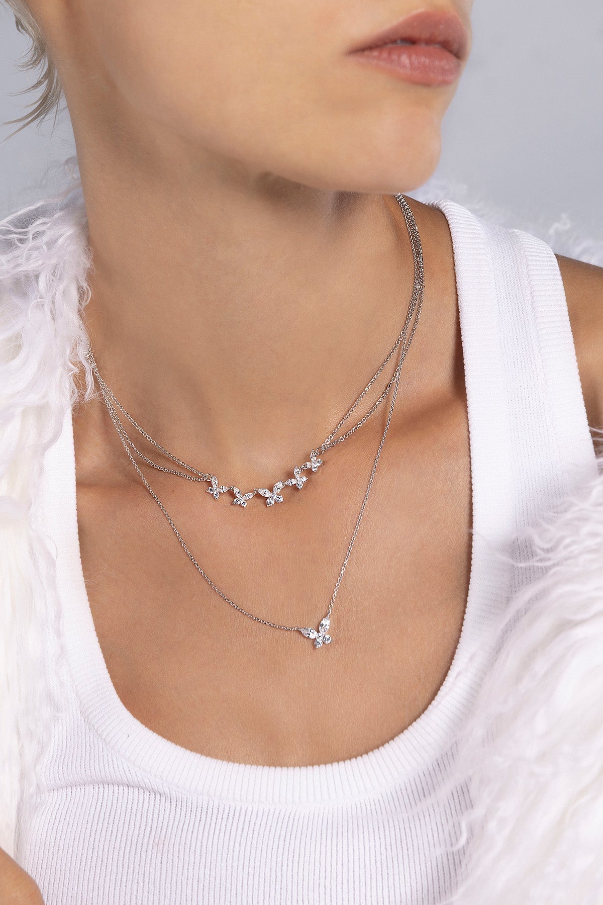 APM MONACO butterflies double chain adjustable necklace in silver worn on model