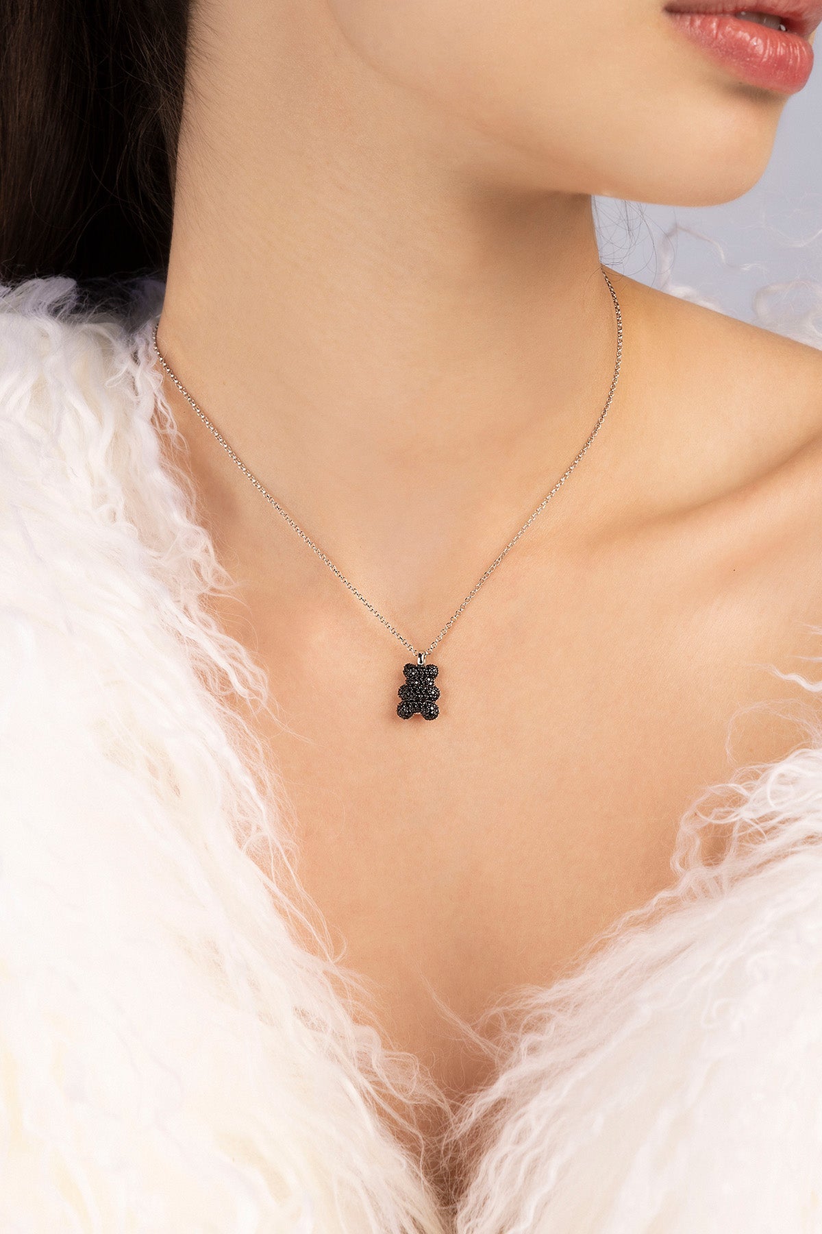 APM MONACO baby mood yummy bear adjustable necklace in black and silver worn on model