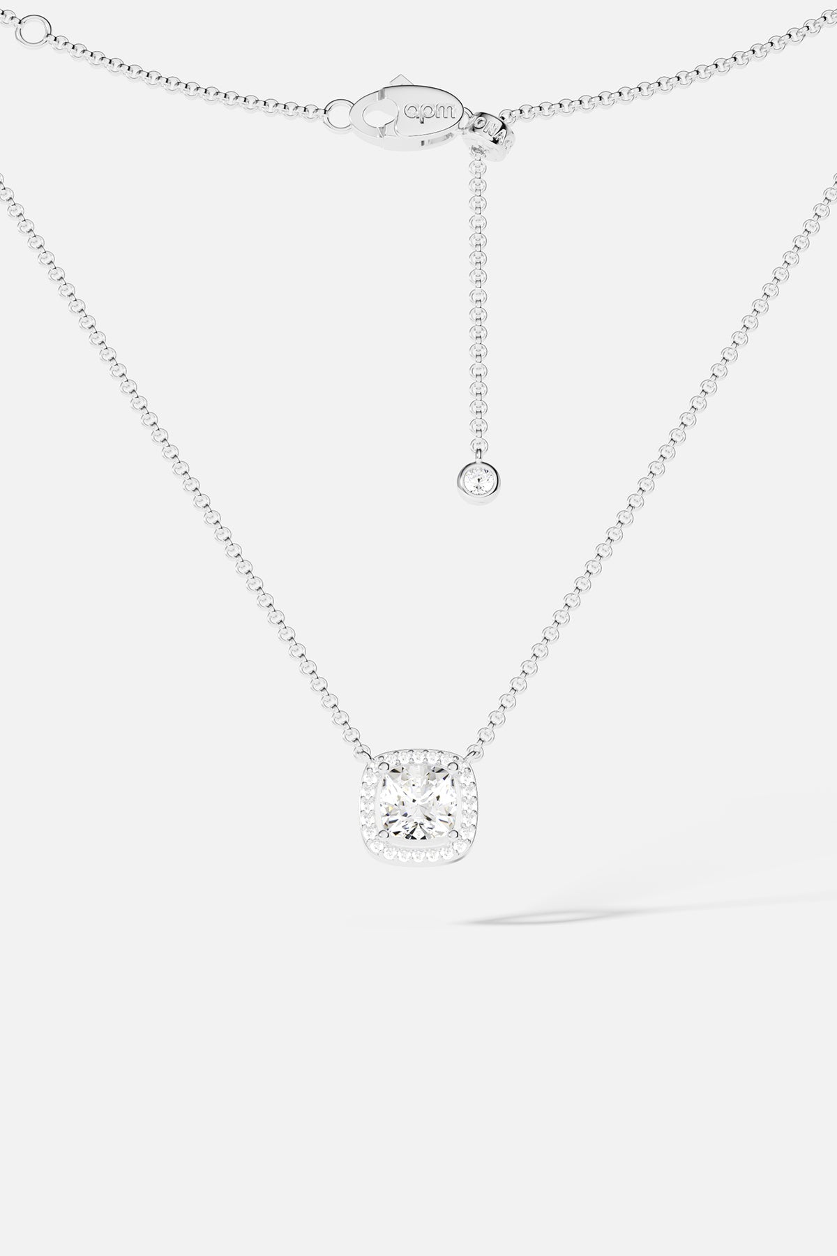 Necklaces APM Monaco: silver-tone adjustable chain necklace with a cushion-cut clear crystal pendant and extender.
