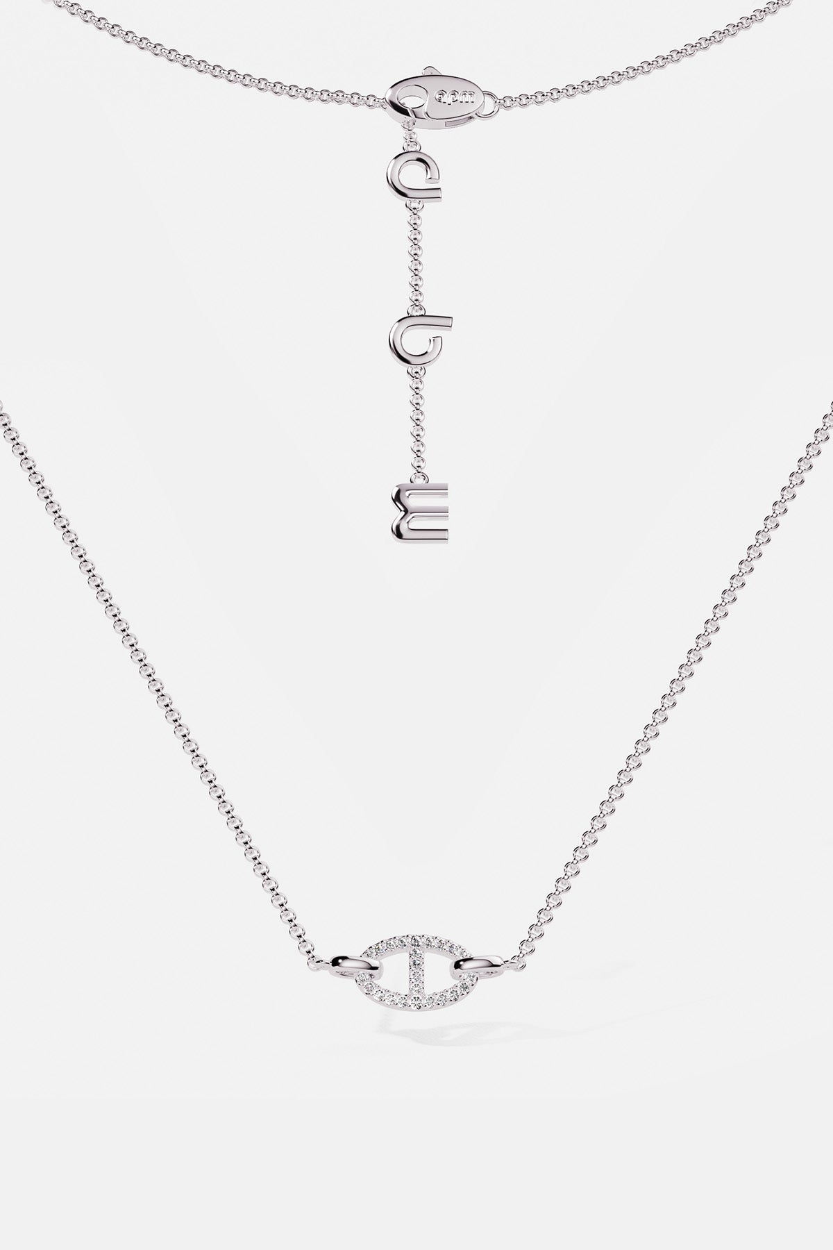 Necklaces APM Monaco, white tone, maille marine chain with a pendant of three hanging letters.
