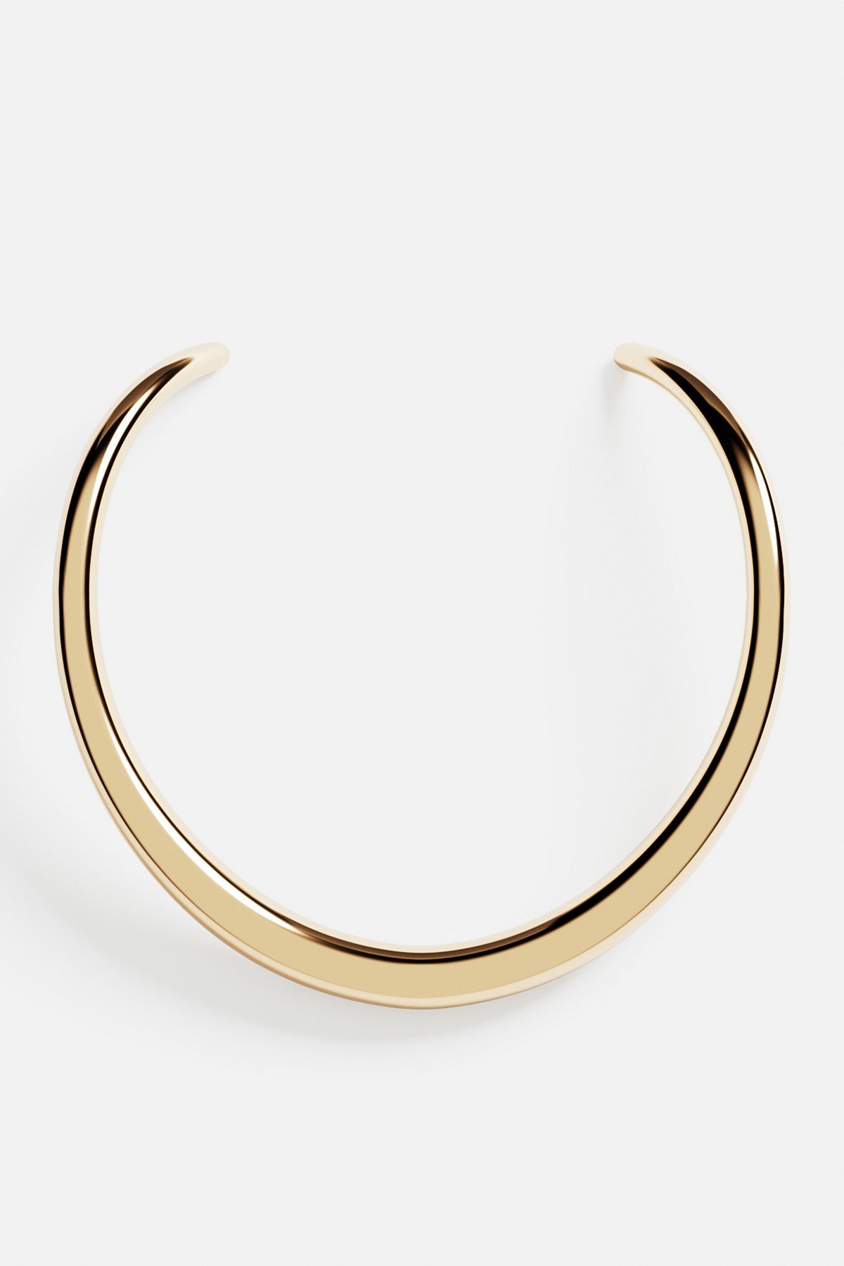 Necklaces APM Monaco. Yellow gold-tone torque-style bold choker with a smooth, seamless band.