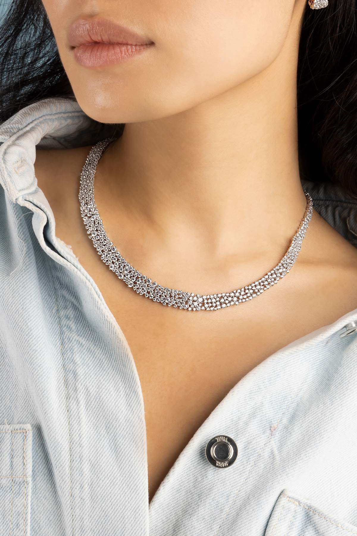 Necklaces APM Monaco: three-strand diamond tennis choker; Earrings APM Monaco: matching stud earrings with white pavé diamonds.