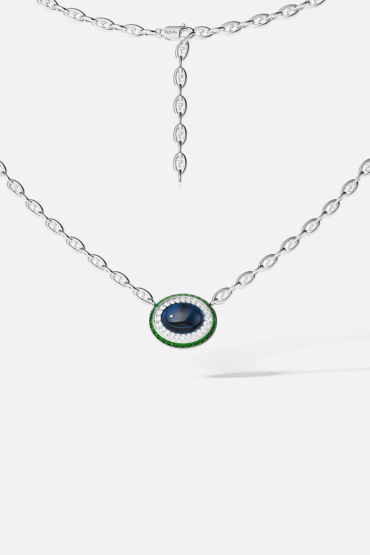 Silver necklace with a blue stone pendant on a white background