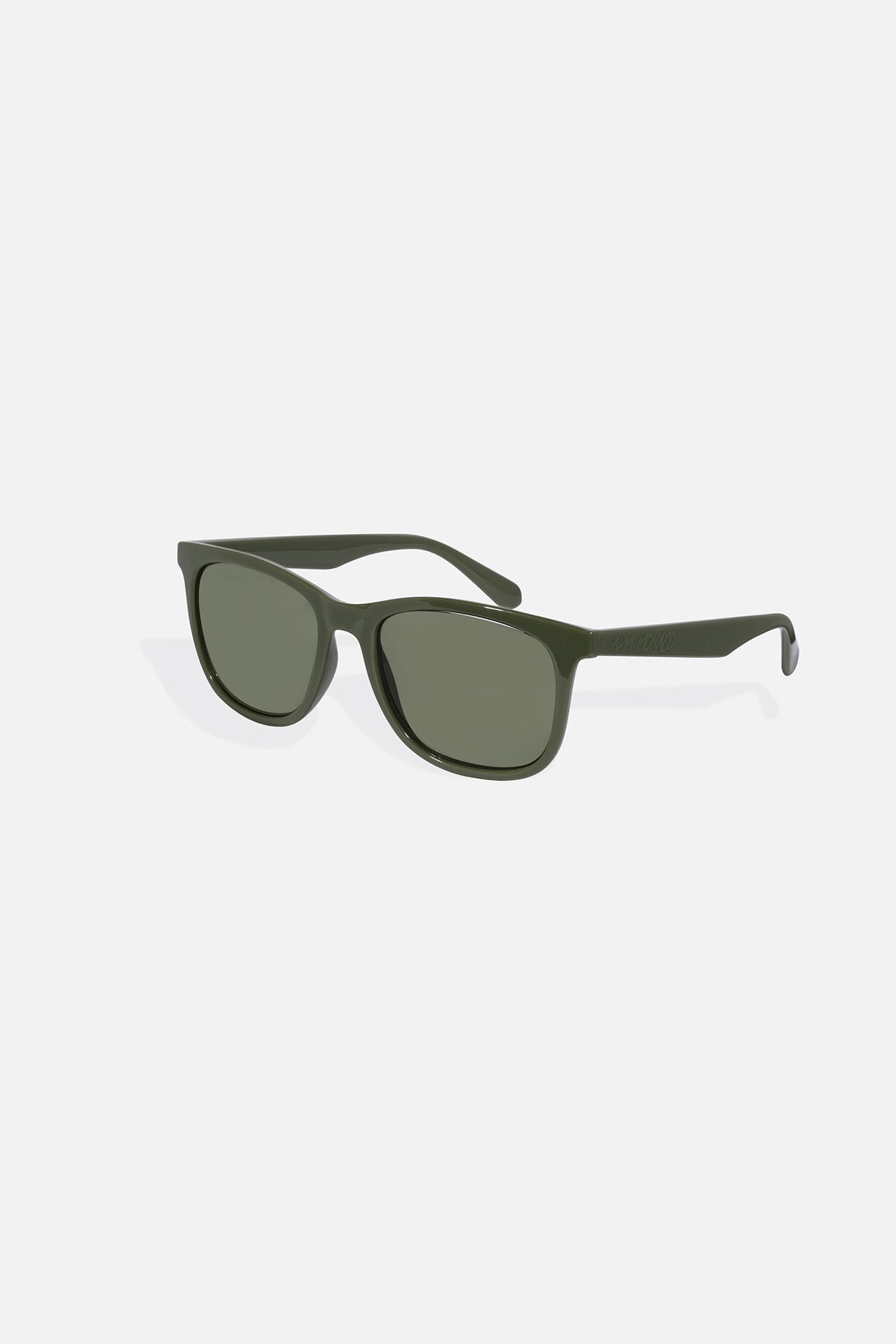 Green sunglasses on a light grey background