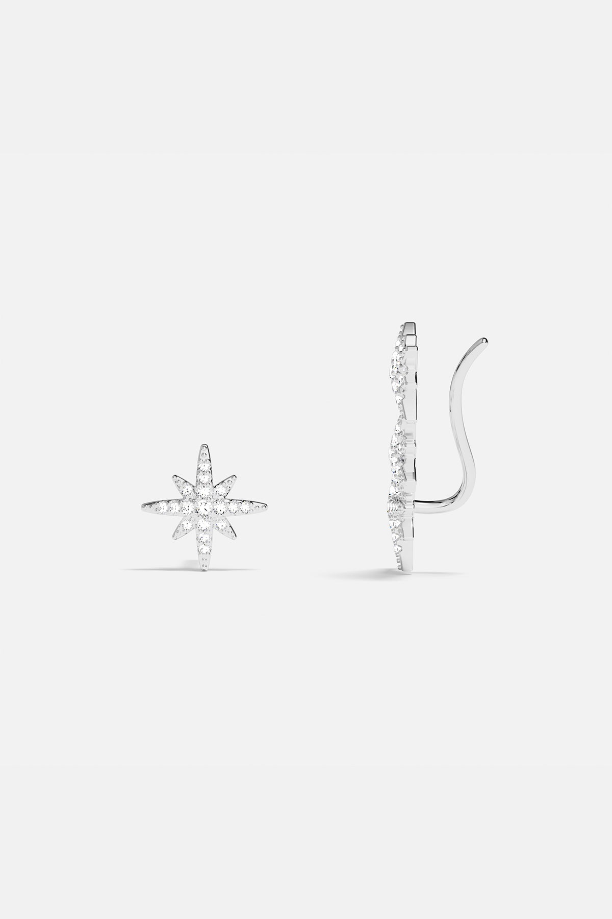 Earrings APM Monaco, silver-tone asymmetric triple meteorite cubic zirconia earrings.