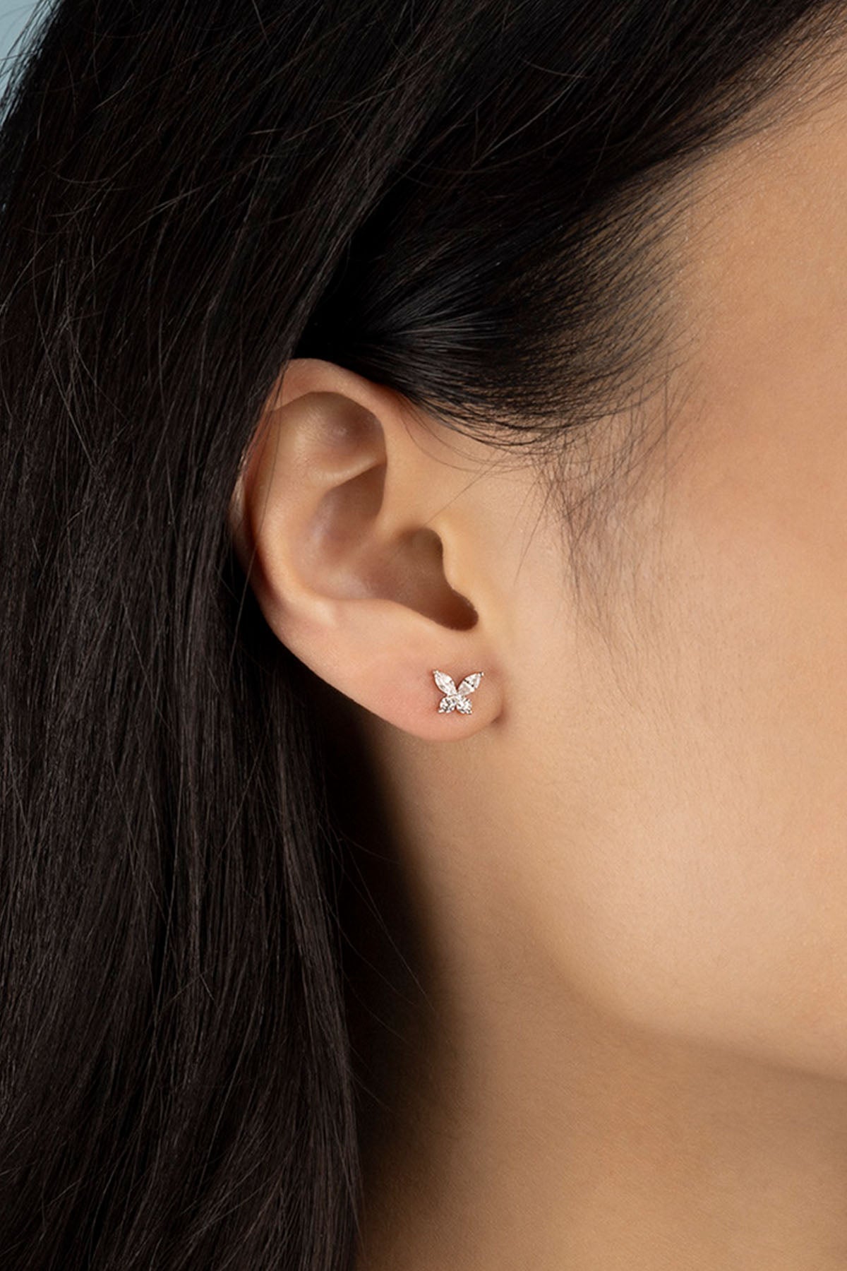 Earrings APM Monaco silver butterfly stud earrings.