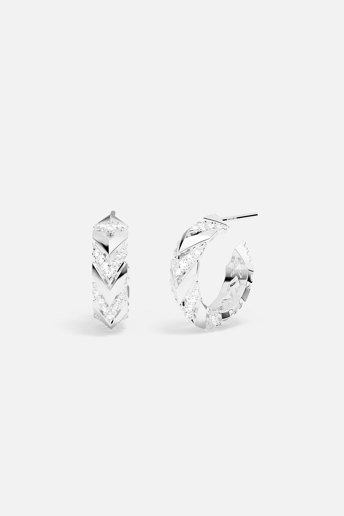 Pair of silver hoop earrings on a white background
