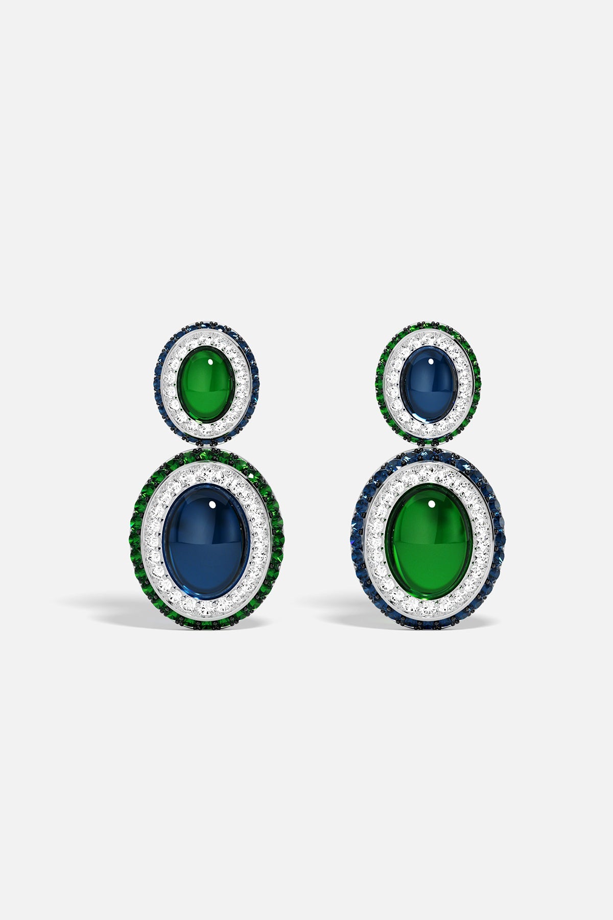Pair of earrings with green and blue stones on a white background