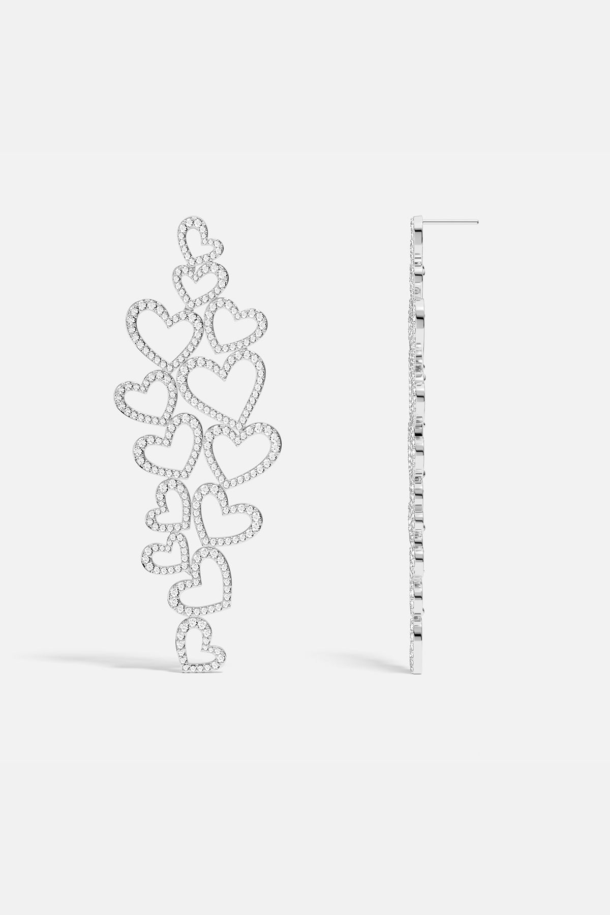 Statement APM MONACO silver heart-shaped earrings on a white background