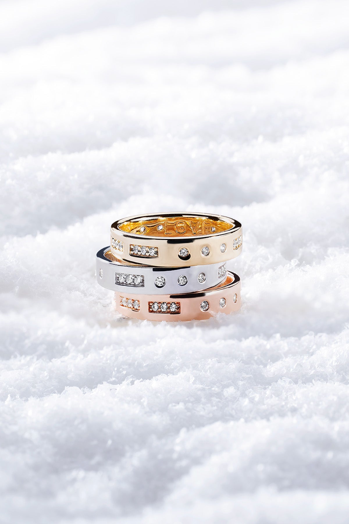 Three rings stacked on a snowy background