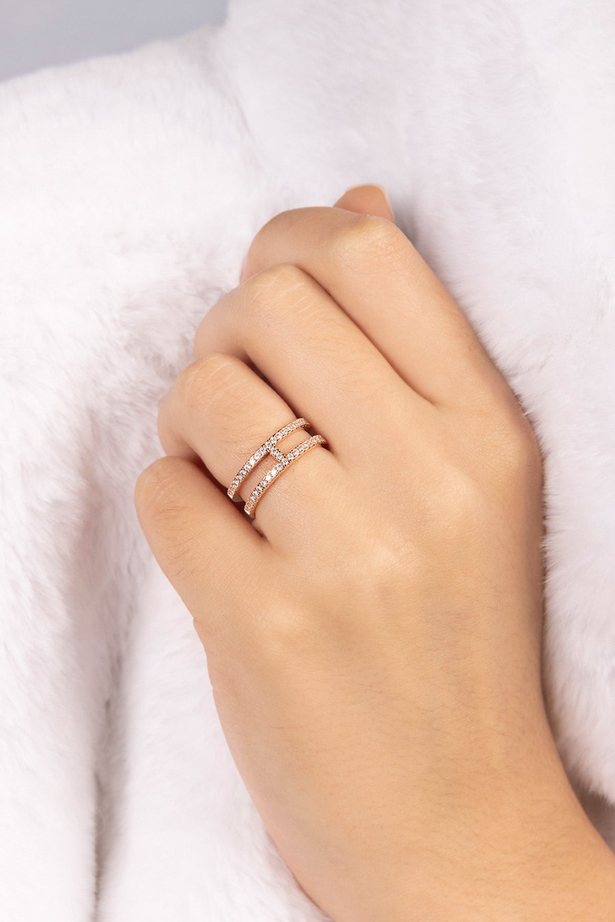 APM MONACO double line pave ring in rose gold worn on hand