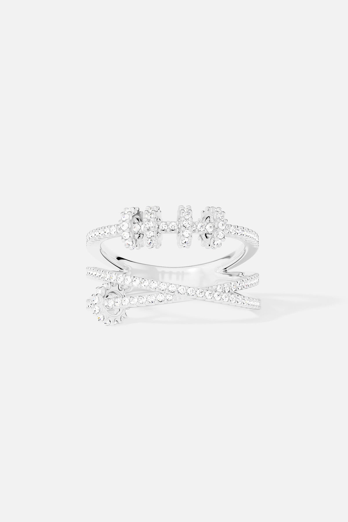 Rings APM Monaco: triple-ring design with sliding hoops; silver-tone band featuring three barbell-shaped elements set with white stones.