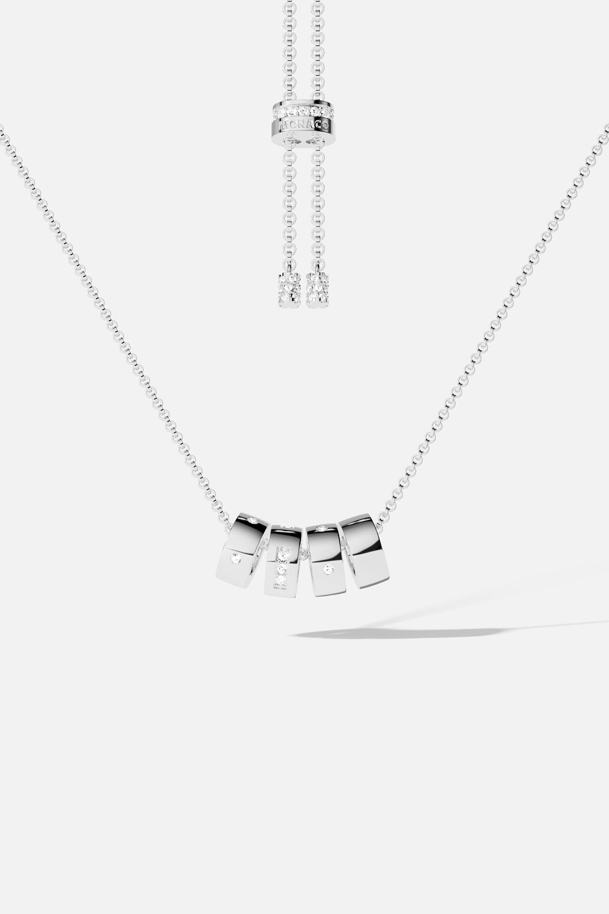 Necklaces APM Monaco adjustable Morse code necklace with five Silver-tone-tone letter charms and a rhinestone accent.