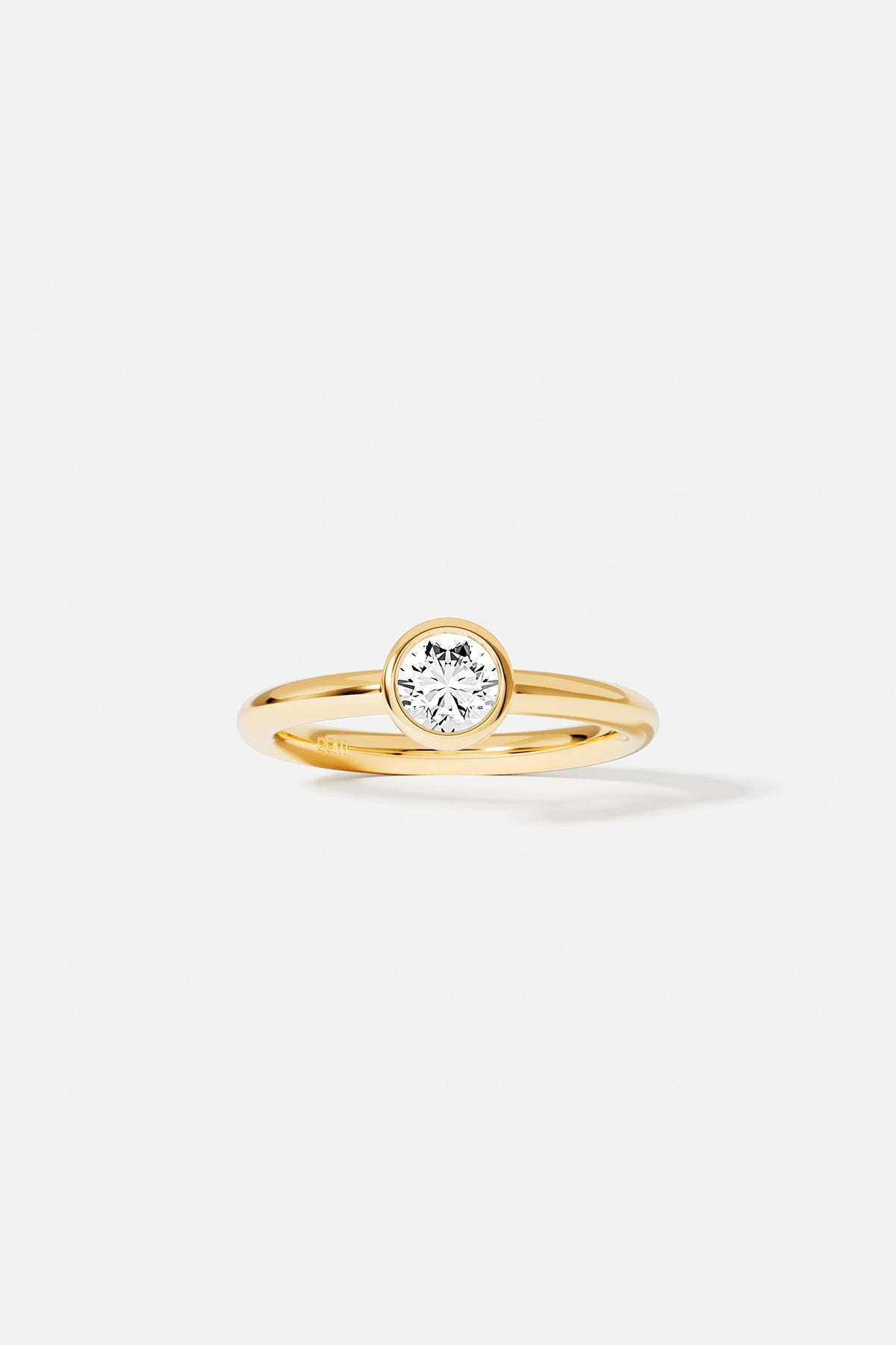 Rings APM Monaco yellow gold solitaire ring with a round diamond.
