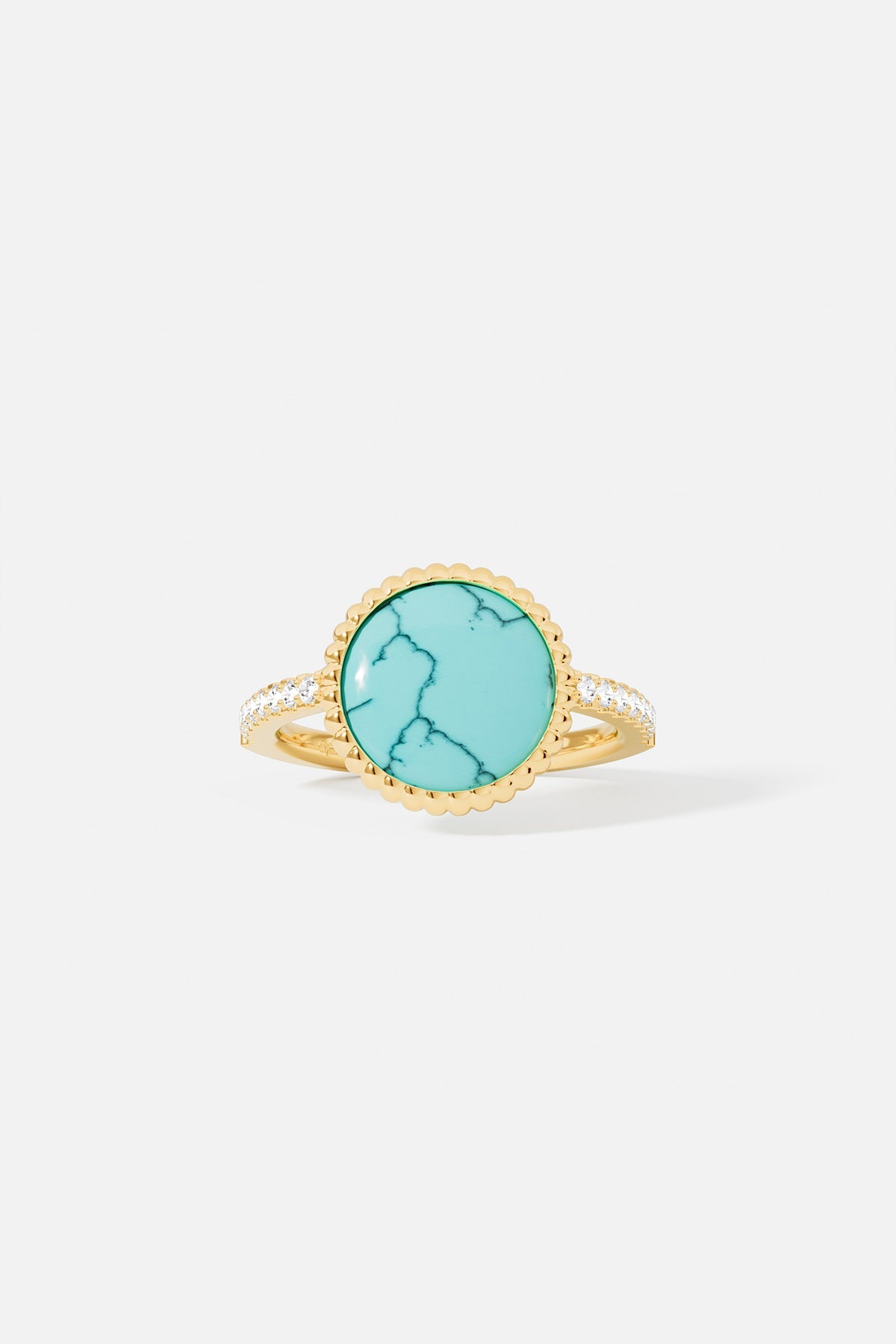 Rings APM Monaco yellow gold ring with a turquoise lagoon centerpiece, close-up view.