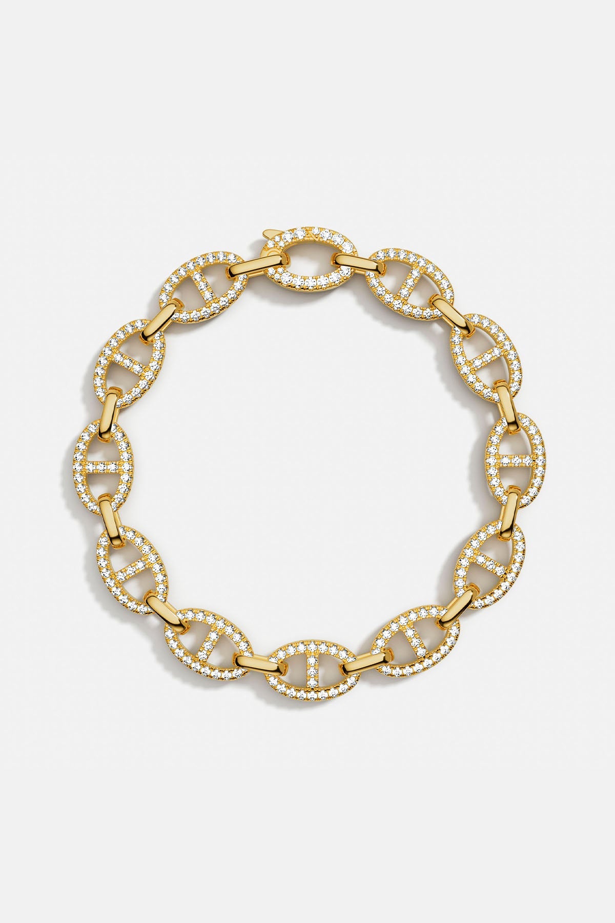 Bracelets APM Monaco: yellow gold chain link bracelet with pavé white cubic zirconia.