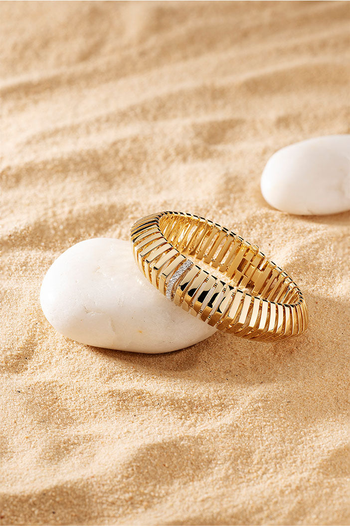 Bracelets APM Monaco, yellow gold chain with sunray motif.