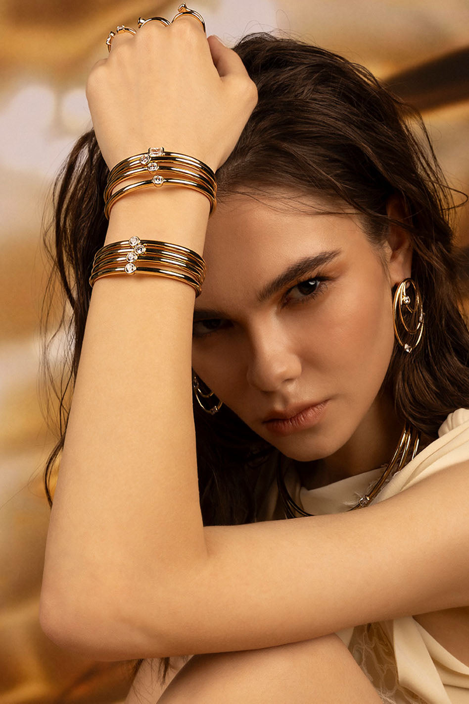 Earrings APM Monaco; Necklaces APM Monaco; Bracelets APM Monaco; Rings APM Monaco. Gold-tone jewelry with simple, elegant styling.